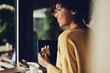 © Yakobchuk Olena - Lady holding her snack in hand and smiling