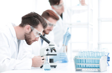 Wall Mural - background image scientists working with the microscope