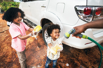 Boys washing the family car