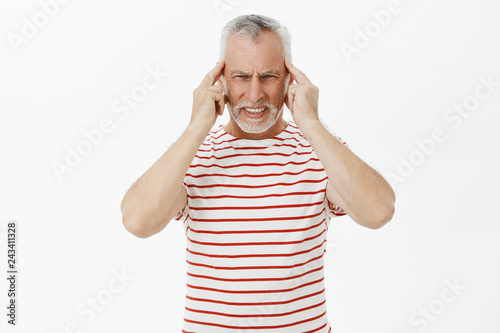 Waist Up Shot Of Disturbed Old Man With White Hair Feeling