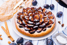 Homemade Plum Pie On The Wooden Background