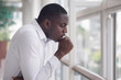 © 9nong - Sick African man coughing; Portrait of ill black man cough due to cold, flu, allergy, polluted air, fine dust, tuberculosis; air pollution, lung cancer, emphysema concept; African man model