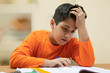 © IndiaPix - Portrait of boy while doing his homework at home