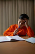 © IndiaPix - Portrait of boy while doing his homework at home