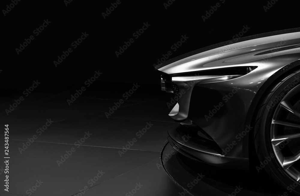 Front detail on one of the LED headlights modern car on black background  - obrazy, fototapety, plakaty 