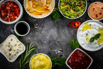 Wall Mural - Selection of sauces in white bowls on white bowls, top view