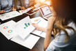 © NDABCREATIVITY - Business and office concept - close up of business team with chats and graphs in office