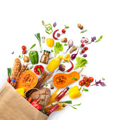 Vegetables, products that fell out of a paper bag, isolated on a white background.