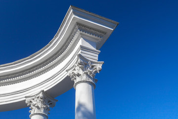 White columns with portico under blue sky at day