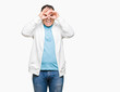 © Krakenimages.com - Middle age arab man wearing sweatshirt over isolated background doing ok gesture like binoculars sticking tongue out, eyes looking through fingers. Crazy expression.