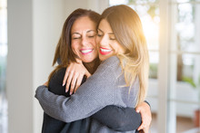 Beautiful Family Of Mother And Daughter Together, Hugging And Kissing At Home