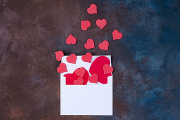 Wall Mural - White envelope with hearts on stone background. Valentine's day background. Love concept.