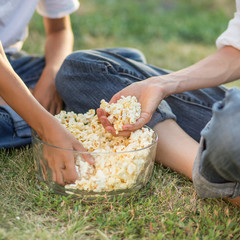 Family eat popcorn