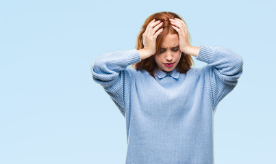 Sticker - Young beautiful woman over isolated background wearing winter sweater suffering from headache desperate and stressed because pain and migraine. Hands on head.