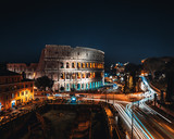 Fototapeta Nowy Jork - Coliseum or Flavian Amphitheatre or Colosseum (Amphitheatrum Flavium or Colosseo), Rome, Italy. Night lights, long exposure photo