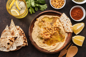 Classic Hummus with chickpeas, paprika, olive oil and oriental spices. Mediterranean popular snack of chickpeas and tahini pasta.