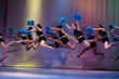 © ig_royal - athletes perform on stage, young cheerleaders perform at the cheerleading championship, girls in a jump, girls are holding pompons, hands raised up, side hurdler