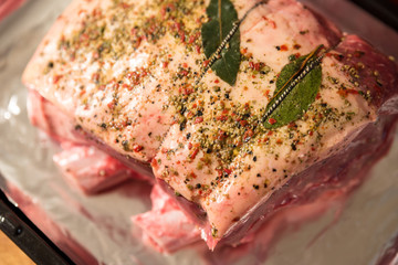 Wall Mural - closeup view raw beef cross rib chunk on oven tray with foil