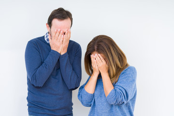 Canvas Print - Beautiful middle age couple in love over isolated background with sad expression covering face with hands while crying. Depression concept.