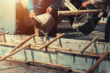 Wall Mural - worker mixing pour construction cement on floor for building house