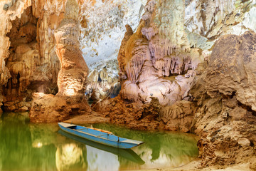 Poster - Scenic blue boat parked inside Phong Nha Cave, Vietnam