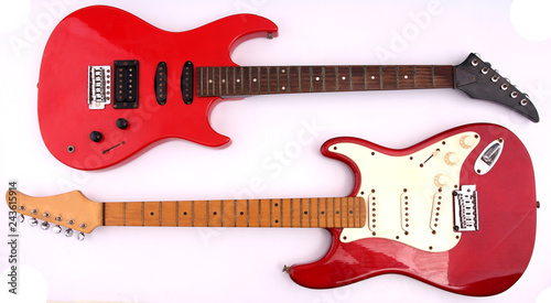Fotografía Red electric guitar with white backdrop.