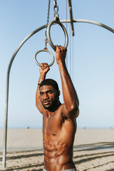 Wall Mural - Fit man working out at the beach