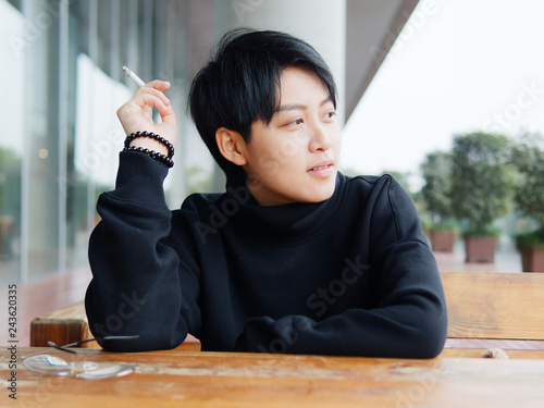 Portrait Of Cute Beautiful Young Lesbian With Short Haircut