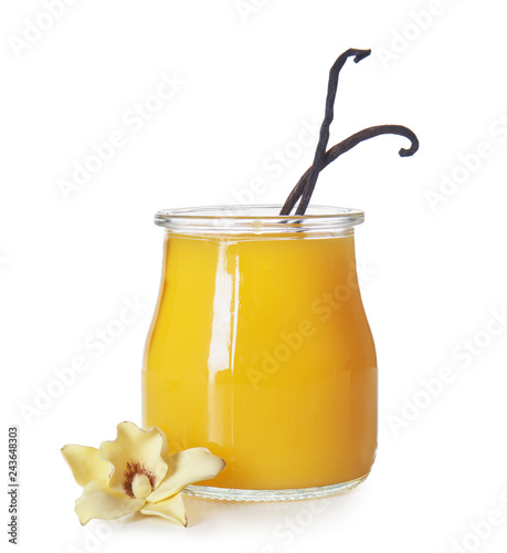 Fotografía Glass jar of vanilla pudding on white background