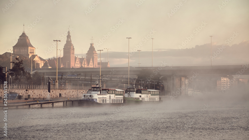 Szczecin City waterfront on foggy morning, color toning applied, Poland. - obrazy, fototapety, plakaty 