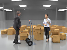 Business People Near Hand Truck And Boxes
