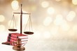 © BillionPhotos.com - Justice Scales and books and wooden gavel on table. Justice