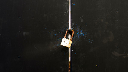 Wall Mural - Old iron door that is securely locked