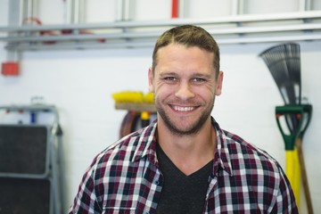 Male carpenter smiling in workshop