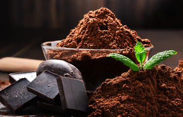 Wall Mural - Composition with bowl of cocoa powder on wooden table