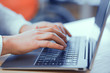 © Svyatoslav Lypynskyy - Hands typing text on a laptop
