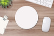 © maddyz - Mouse pad mockup. Round white mat on the table with props, mouse and keyboard