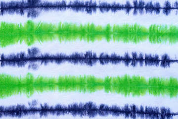 striped tie dye pattern hand dyed on cotton fabric abstract background.