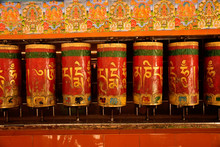 Rotating Prayer Wheels With Inscriptions On Them