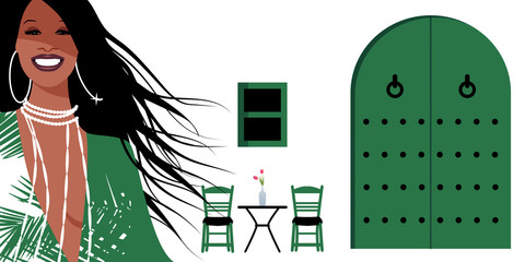 Wall Mural - Woman with long brown hair and large earrings, on background of typical Spanish Mediterranean style village. Green door and window, chairs and small table with vase on white walls.