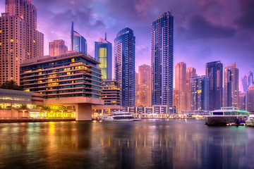 Beautiful view to Dubai Marina Promenade, UAE. Long exposure and HDR effect in the dusk