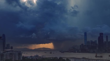 Fototapete - Victoria harbor of Hong Kong Island with sunny stormy sky, China