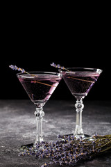 Wall Mural - Fresh lavender violet cocktail with  on a dark background