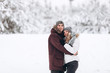 © Aleksandr - Young couple in love outdoor snowy winter