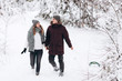 © Aleksandr - Happy young couple in winter park laughing and having fun. Family outdoors