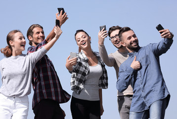 Canvas Print - group of young people taking a selfie.