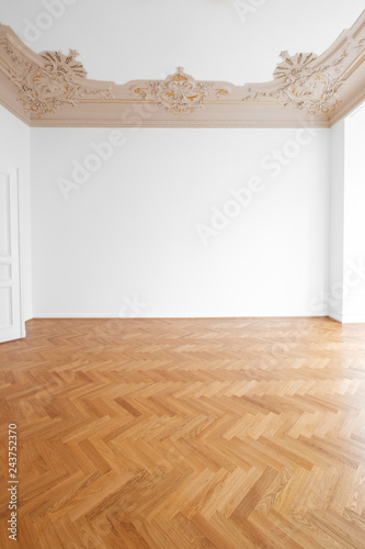 Parquet Floor White Walls And Stucco Ceiling In Empty Room
