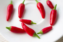 Red Chili Peppers In A White Plate
