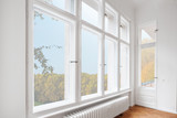 Fototapeta Panele - big wooden windows in apartment room of old building