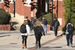 College students walk around campus on a cold winter morning